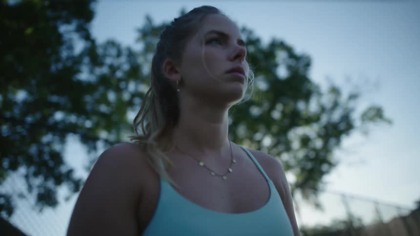 Portrait of a concentrated blonde woman playing tennis