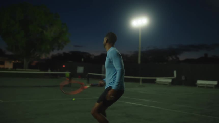 A male tennis player returns multiple shots on an outdoor court