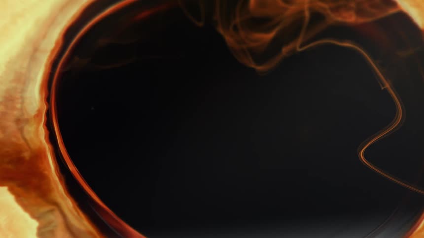 An effect where orange light expands outwards revealing a black void
