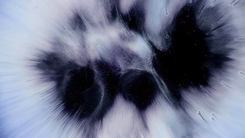 Dense and bright abstract expanding texture on a black background