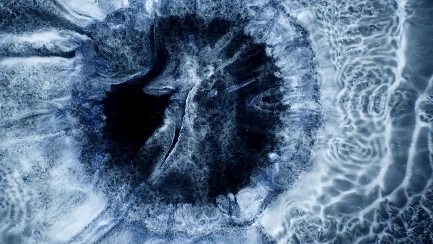 A circle in the fluid art slowly spreads out
