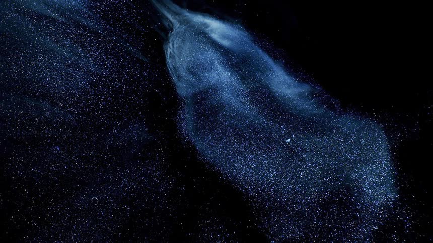 Extreme closeup on an abstract powder blue against a black background