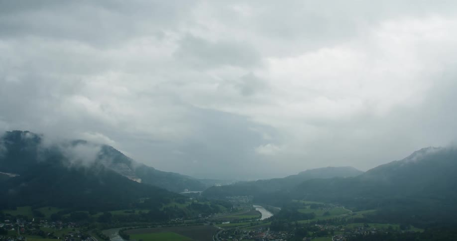 Fog covers the river and mountains