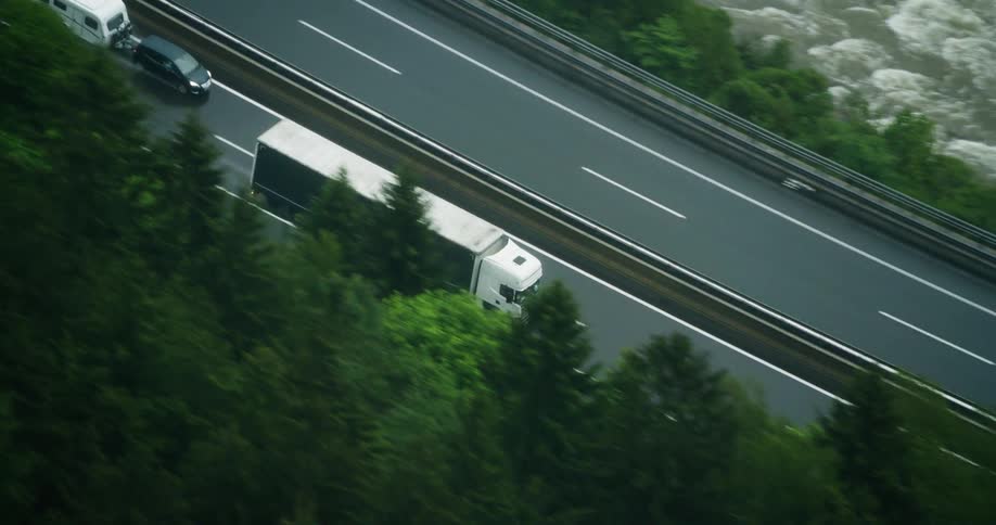 Aerial panorama of a cargo truck traveling on a highway