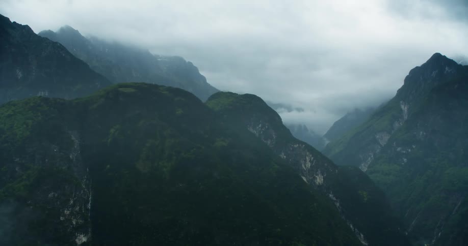 The peak of the mountains hit the clouds