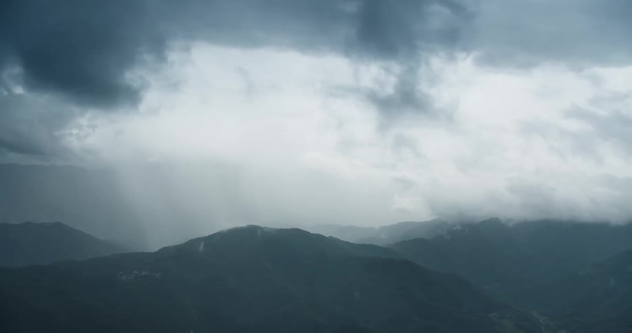 Aerial scenery on a cloudy day over mountains