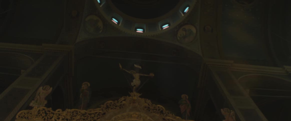 View of a dark domed cathedral from inside