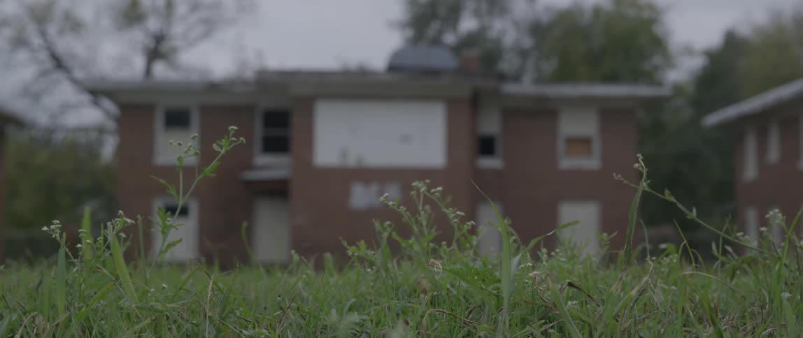 Brick building standing  on a cloudy day