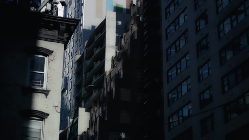Urban and commercial buildings in a metropolis with a reflection of sunlight