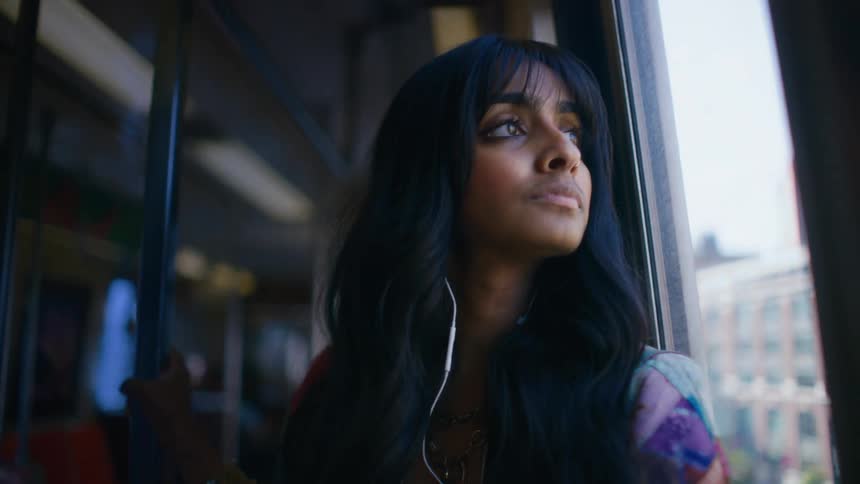 A woman is riding on the train