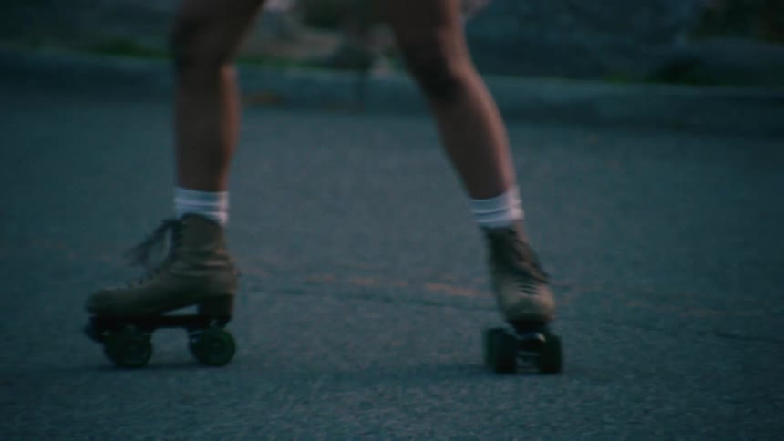 Legs of a woman roller skating