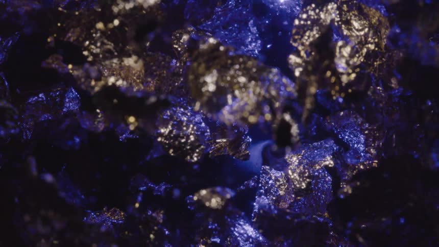 Crystalline rocks shining with silver and blue light