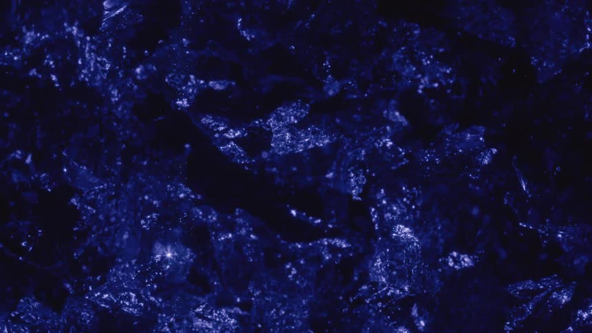 Crystalline rock shining with blue light
