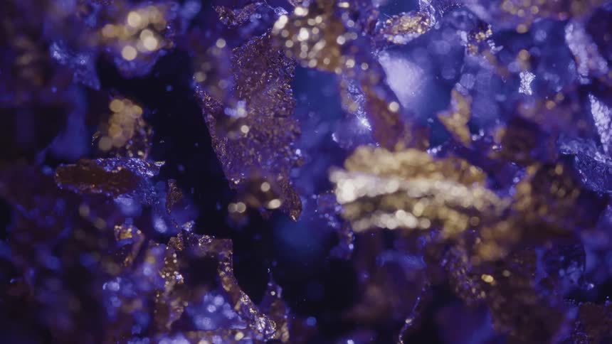 Purple liquid with abstract shiny leaves