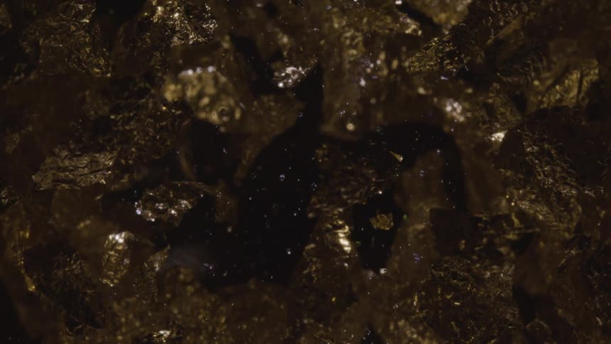 A crystalline rock formation reflecting light