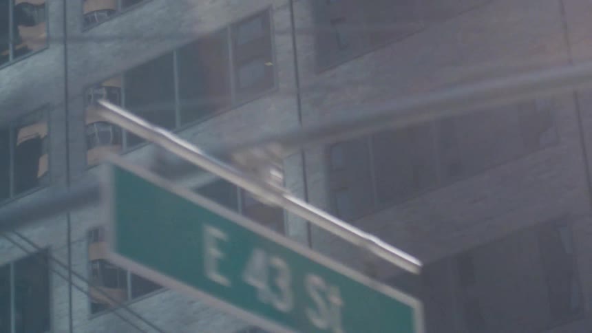 The building has rows of reflective windows