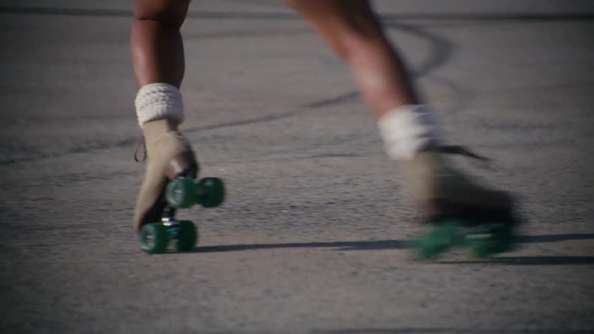 Legs of a woman roller skating