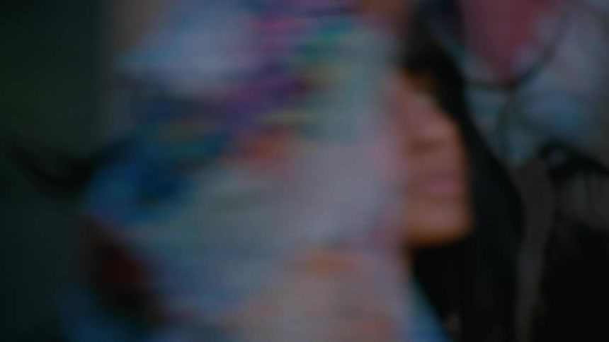 An indian woman dances in a circle outdoors