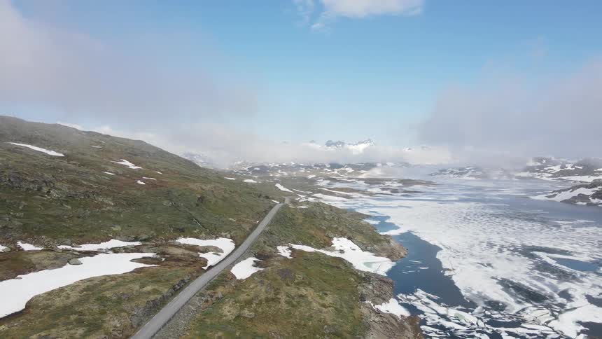 Ice floats on the river by the mountain road