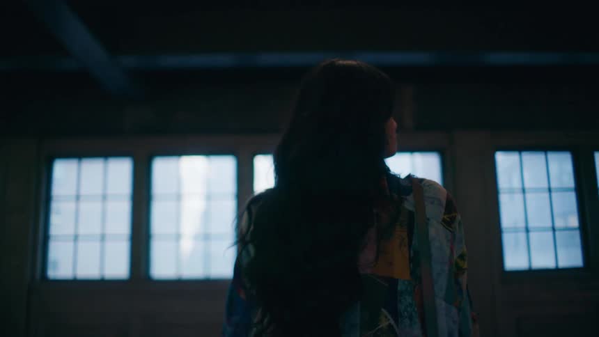 The train passes the woman in the subway