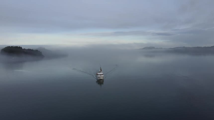 A fishing boat is traveling in the peninsula