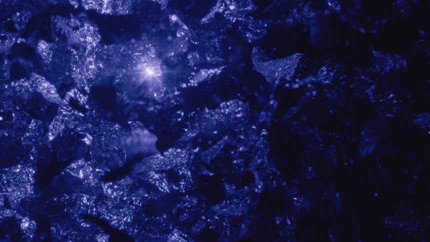 Purple light emerging from a liquid with abstract glowing crystals