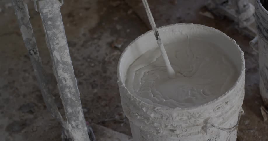 Plaster being mixed in a bucket