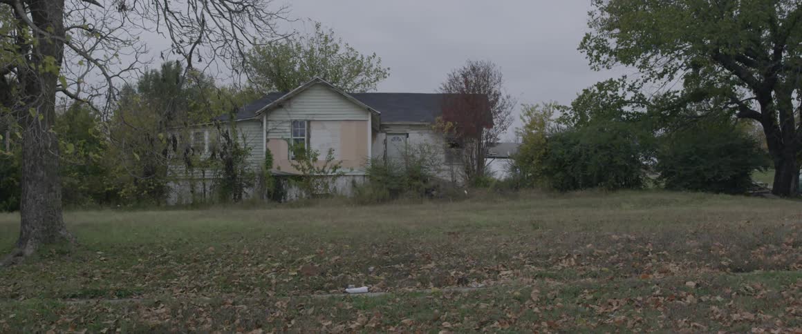 A house with lots of leaves on the yard