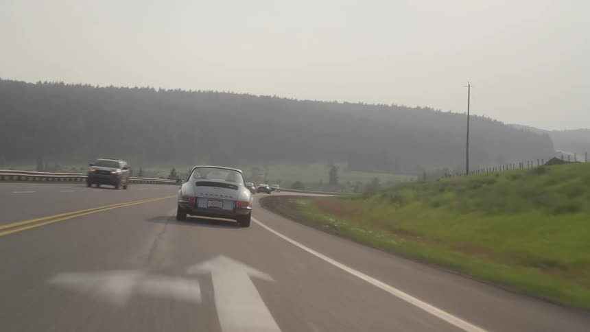 Cars driving down a highway
