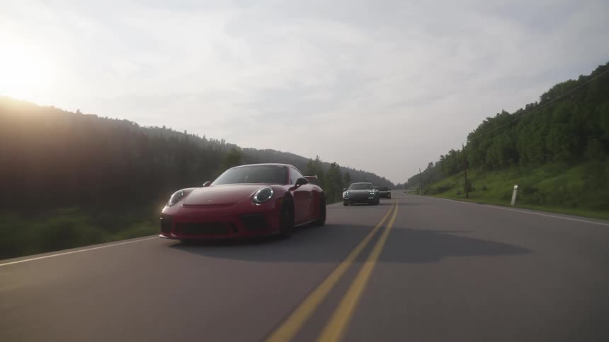 Sports cars ride together on the highway