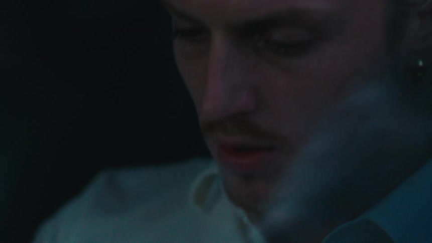 A man is smoking a cigarette