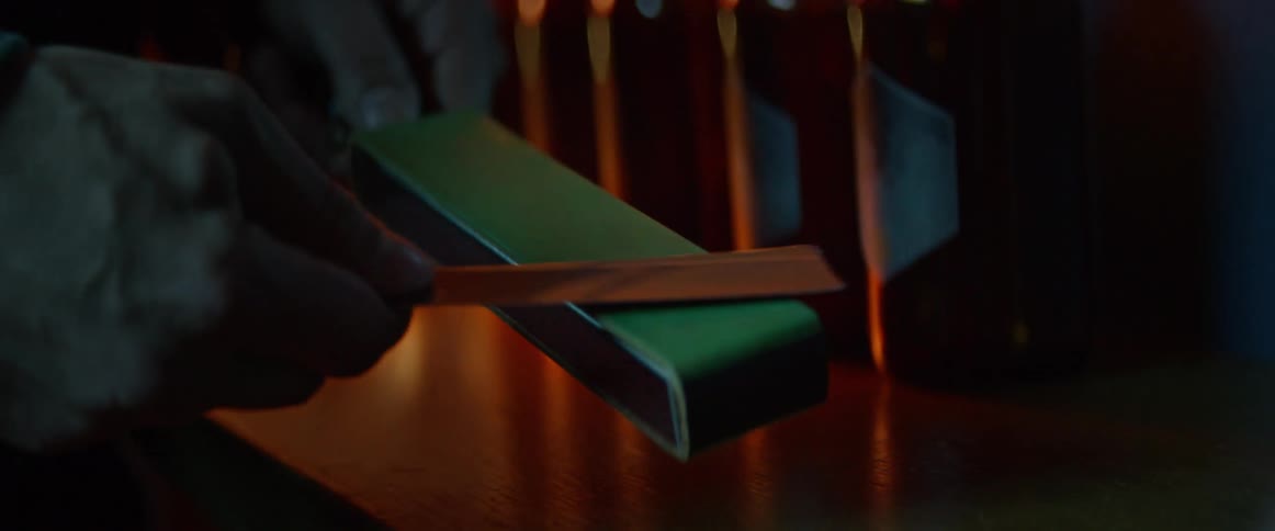 Person sharpening a razor
