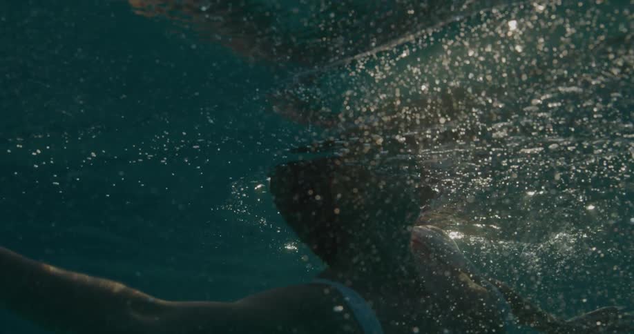 A woman is swimming in the water