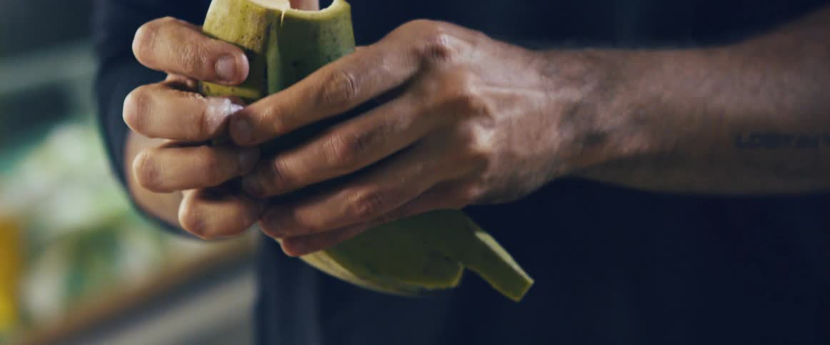 A chef prepares plantains by hand