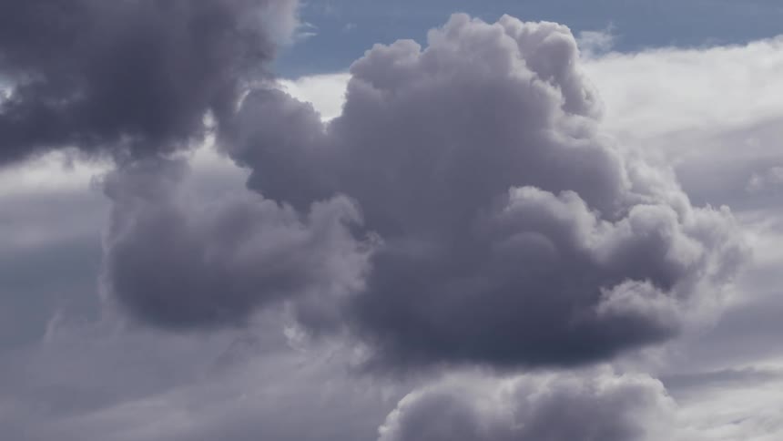 The clouds slowly expand in the sky