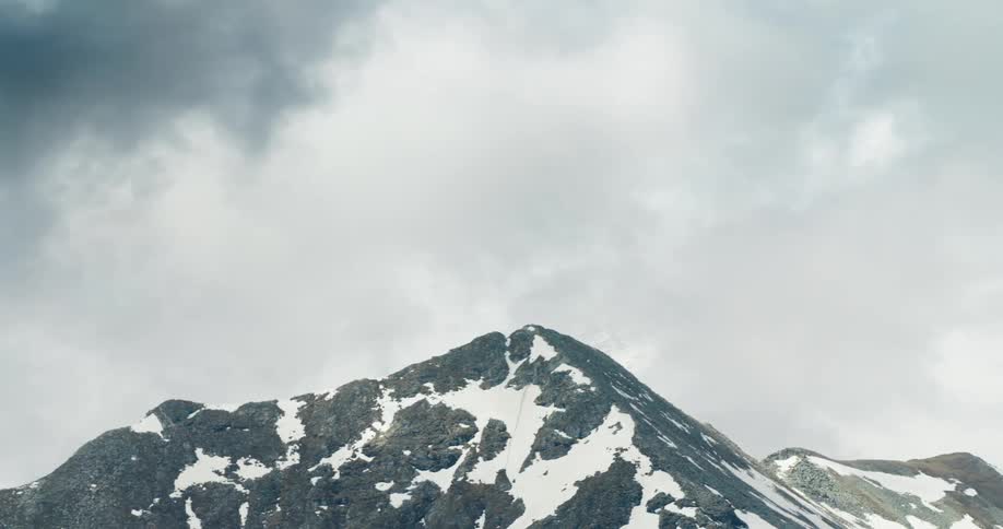 Mountains with snowcapped peaks on a cloudy day