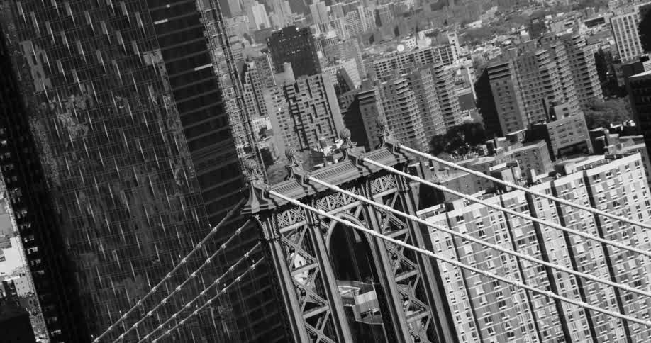 A bridge is near the tall building