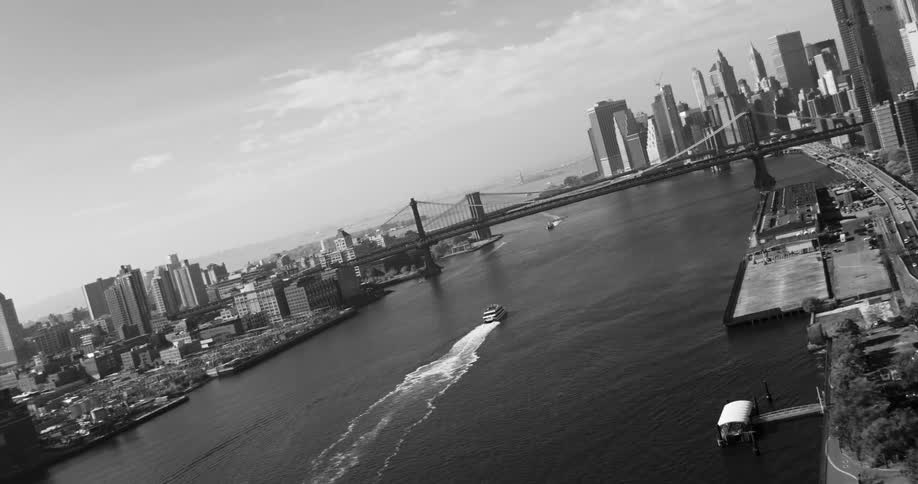 Panorama of a maritime canal and a bridge in front connecting a metropolis