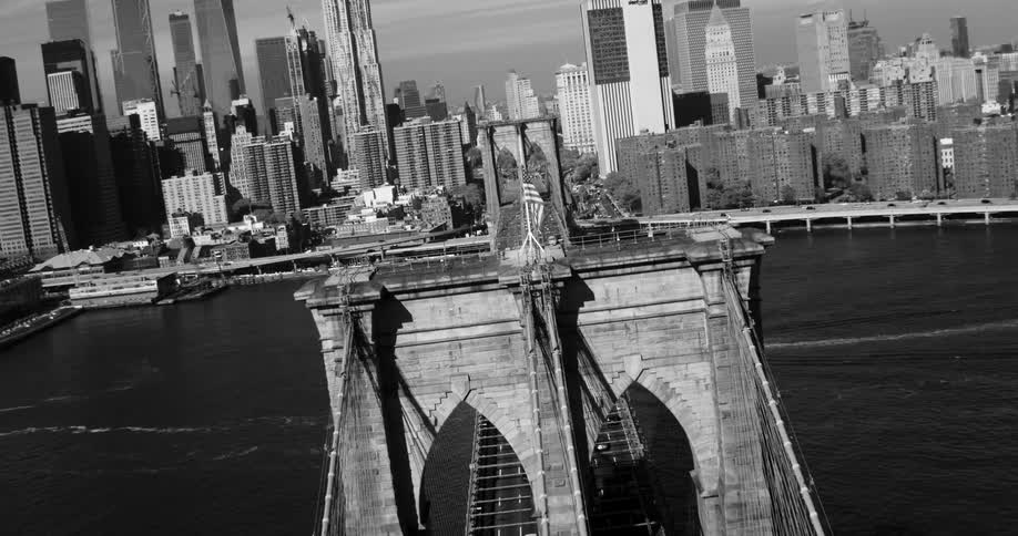 The brooklyn bridge leads to the towers ahead