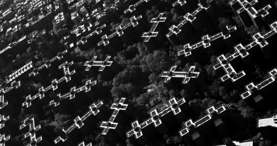 Roofs form shapes with multiple cross pieces in forested neighborhood