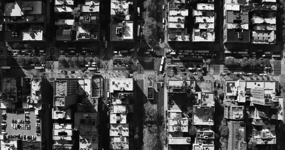 Traffic moves around a city suburb