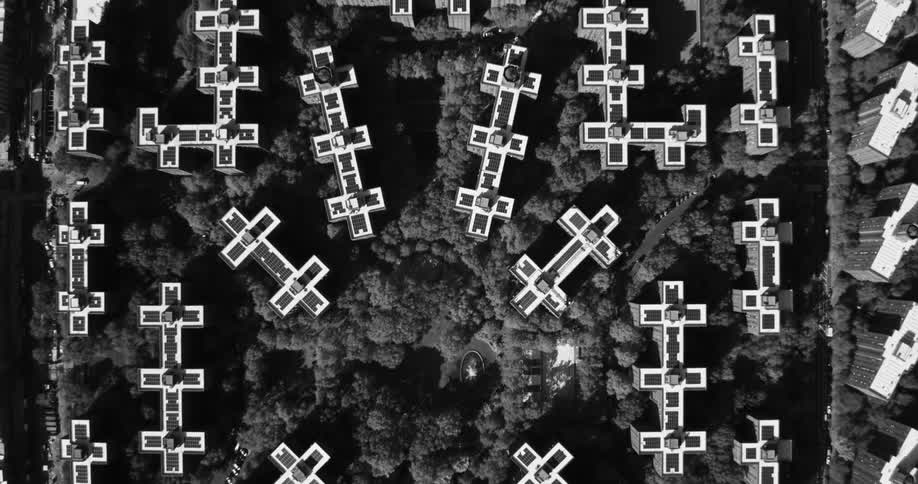 Aerial panorama of residential and commercial buildings in a metropolis with trees