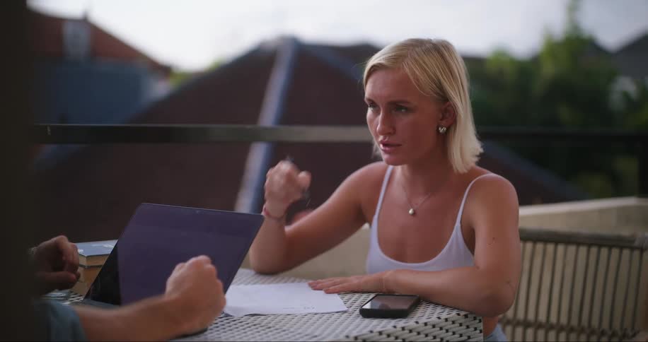 Woman and man sitting at a table talking