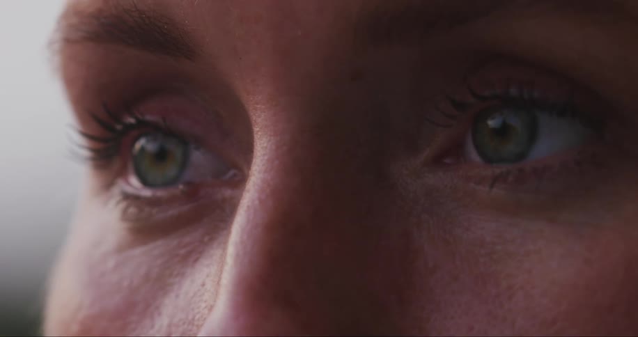 A woman blinks and smiles