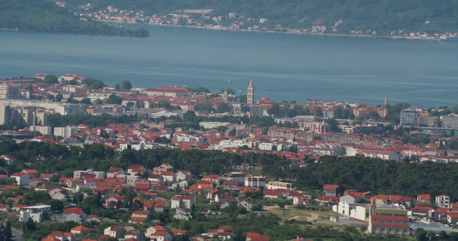 A city sitting on a lakeshore