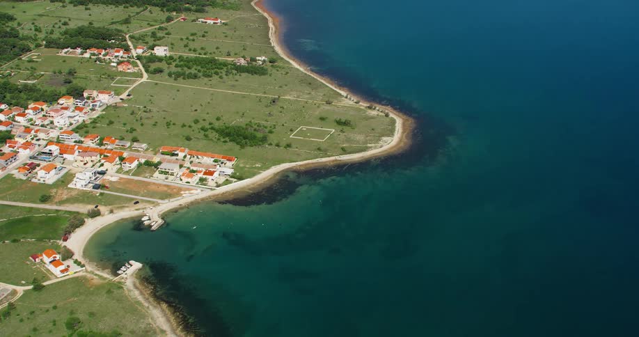 Aerial view coastal neighborhood and blue water