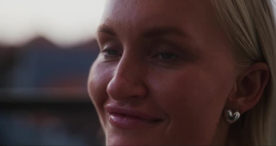 Portrait of a young blonde woman with happy facial expression