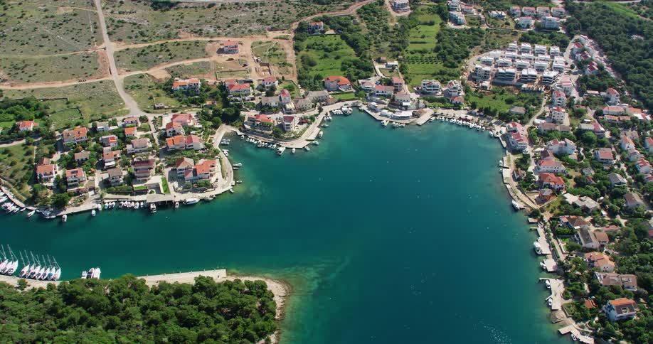 The small town sits by the blue shore