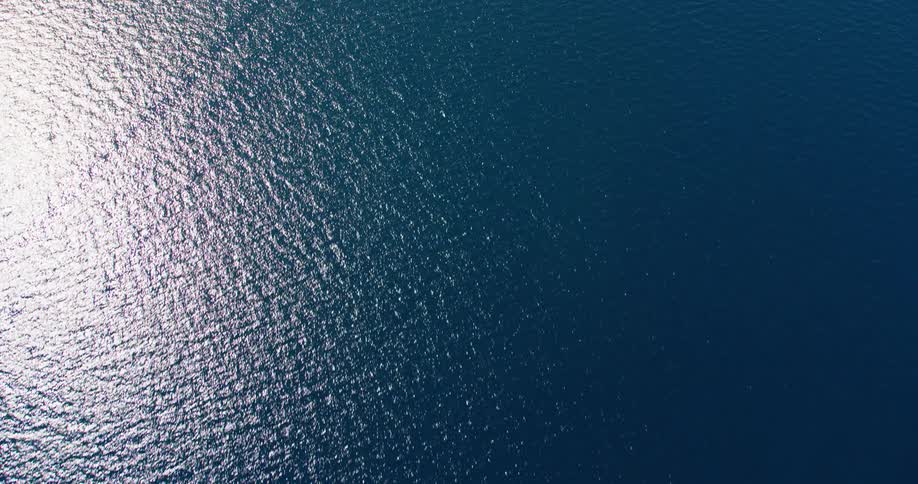 Waves move across a deep blue ocean