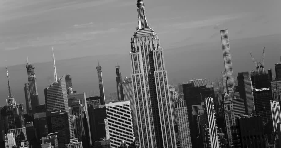 The empire state building is in the middle of the city